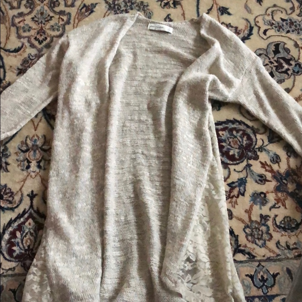 Cute cardigan with lace cutouts on the sides